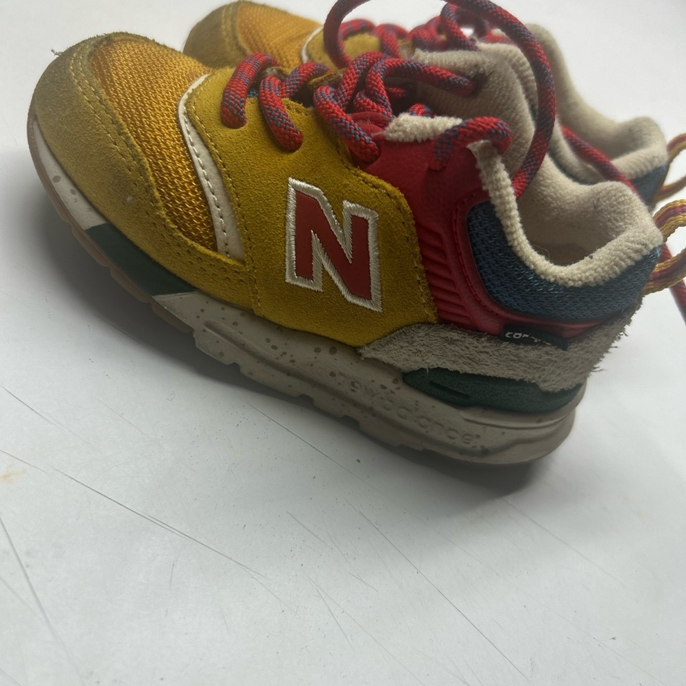 New Balance Yellow and Red Sneakers with Retro Style